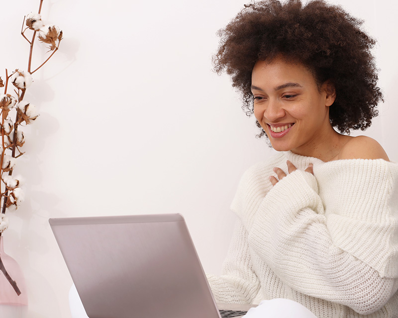 Young multi-racial young woman with a laptop for online therapy for life transitions