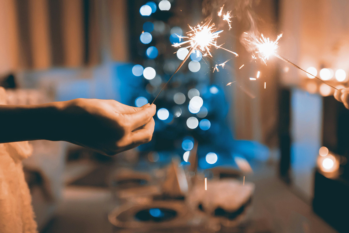 Sparklers over a holiday table; surviving holidays as part of the AAPI community